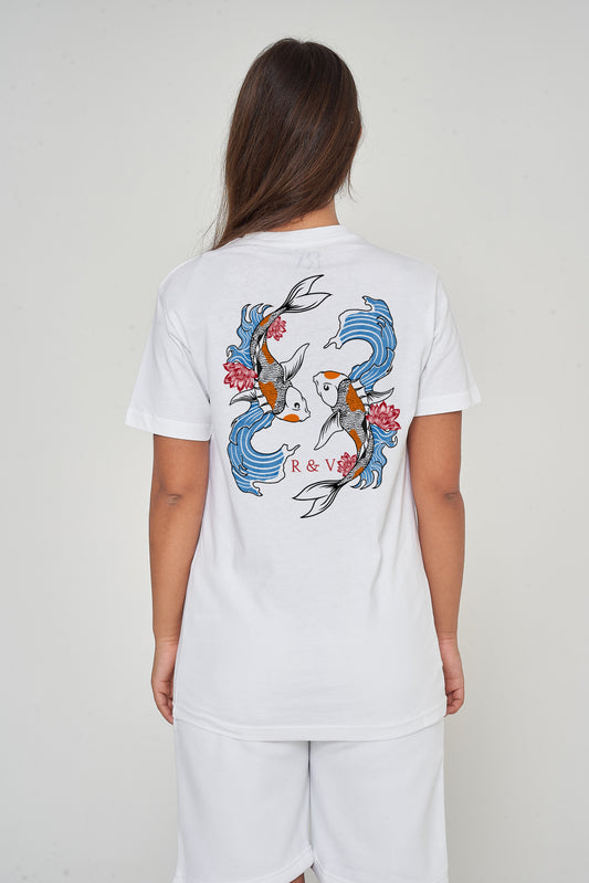 Woman wearing the white Twin Koi Oversized T-Shirt styled with casual bottoms, showcasing the striking koi fish back print and comfortable oversized silhouette.