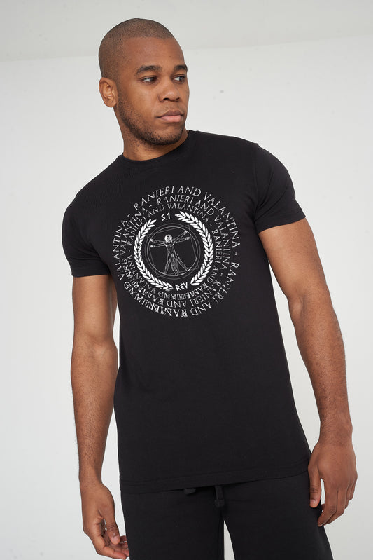 Man wearing the black Vitruvian T-Shirt styled with casual bottoms, highlighting the front artistic graphic and comfortable oversized fit.