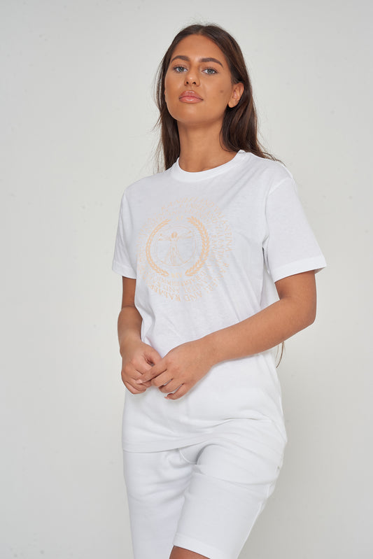 Woman wearing the white Vitruvian T-Shirt styled with casual denim bottoms, highlighting the front artistic print and comfortable oversized fit.