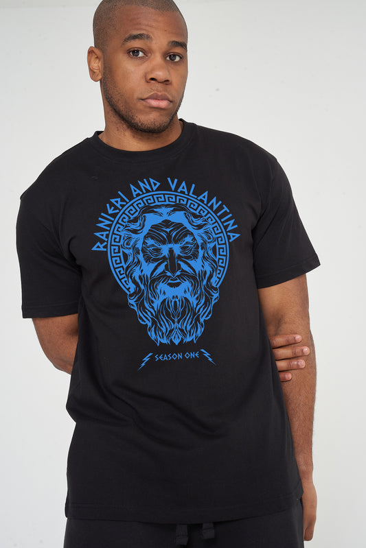 Man wearing black Zues Blue Print Graphic T-Shirt styled casually with dark denim, showcasing the front graphic and relaxed fit.