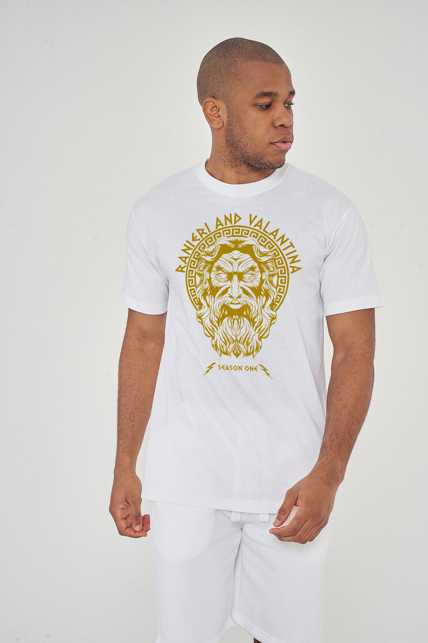 Man wearing white Zues Yellow Print Graphic T-Shirt styled with dark denim, showcasing the front graphic and relaxed oversized fit.